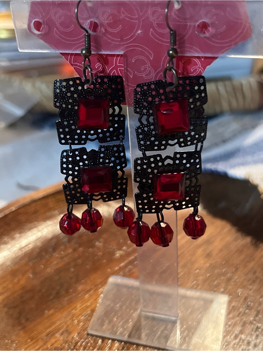 Charming Charlie Black Filigree Earrings with Red Stones